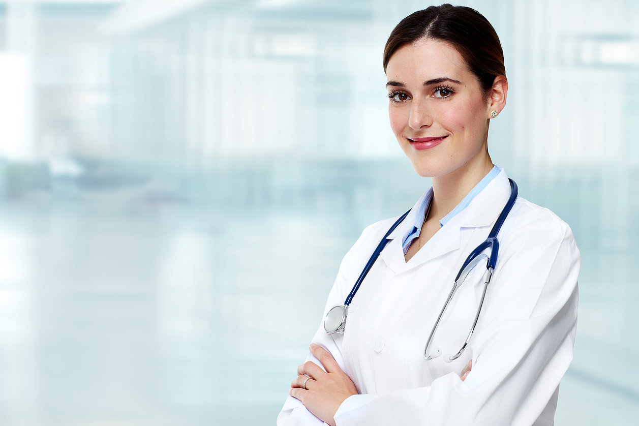 Medical physician doctor  woman over blue clinic background.